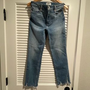 Paige size 27 women’s jeans in medium wash with distress detail